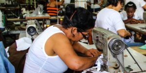 Worker at sewing machine