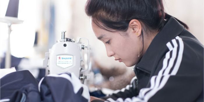 Worker at sewing machine